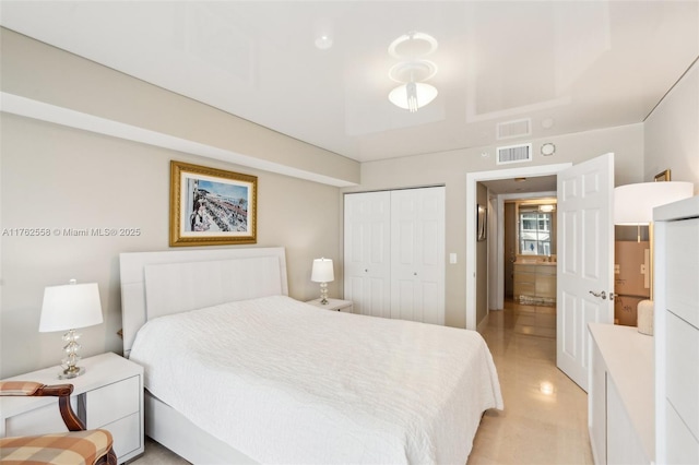 bedroom with a closet and visible vents