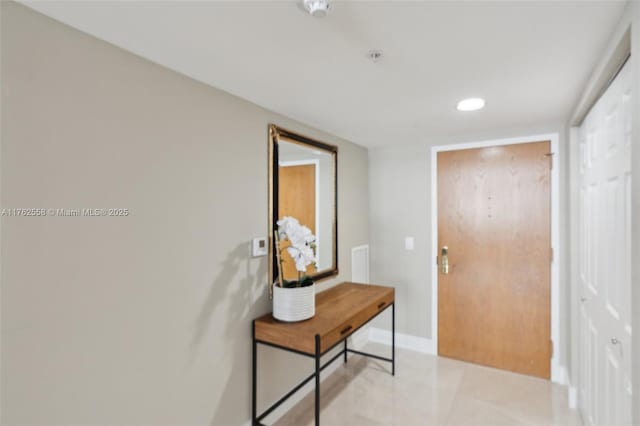 interior space with tile patterned floors, recessed lighting, and baseboards