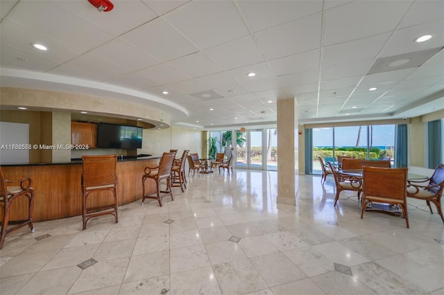 16711 Collins Ave Unit 704, Sunny Isles Beach, FL 33160 - dining space with a drop ceiling and light tile patterned floors