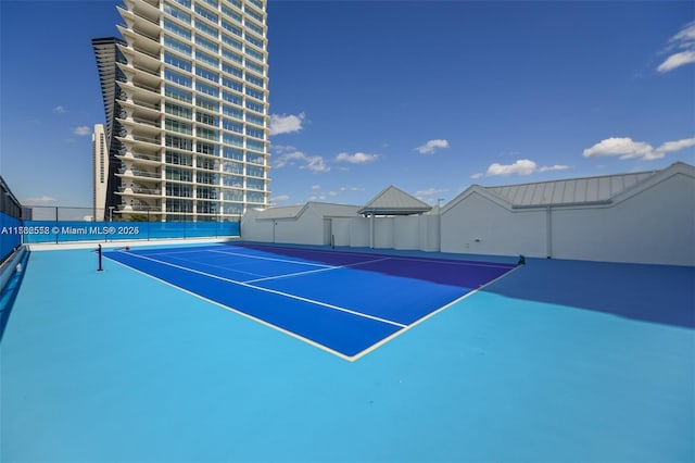 view of tennis court with fence