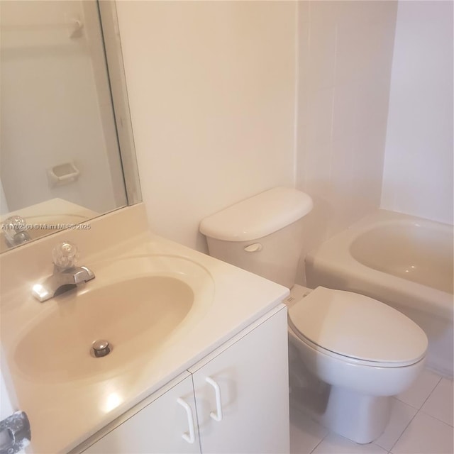 bathroom with vanity, toilet, and tile patterned flooring