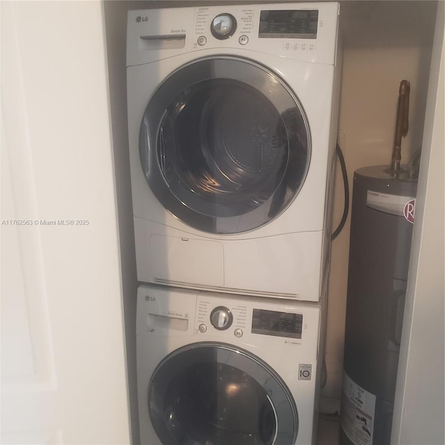 washroom with water heater, laundry area, and stacked washing maching and dryer