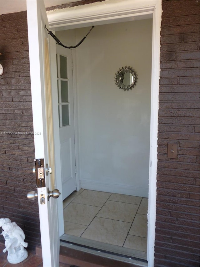 entrance to property with brick siding