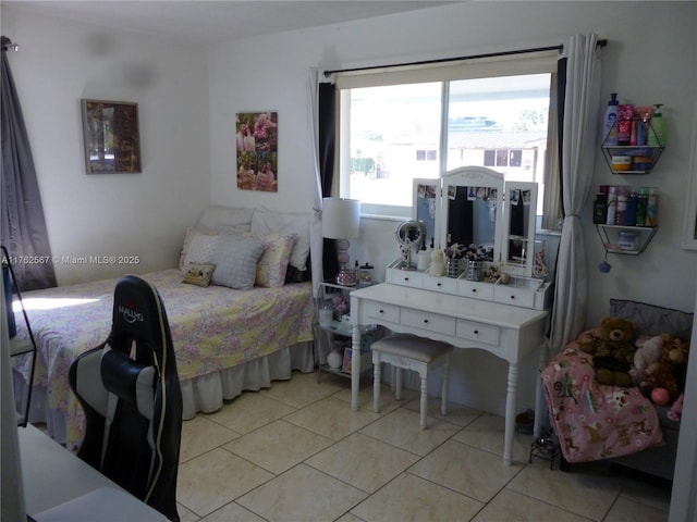 bedroom with light tile patterned floors