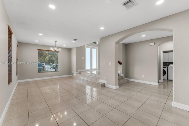 unfurnished room featuring independent washer and dryer, visible vents, light tile patterned floors, stairway, and recessed lighting