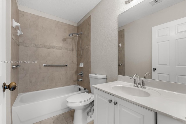 bathroom featuring visible vents, tile patterned flooring, shower / tub combination, vanity, and toilet