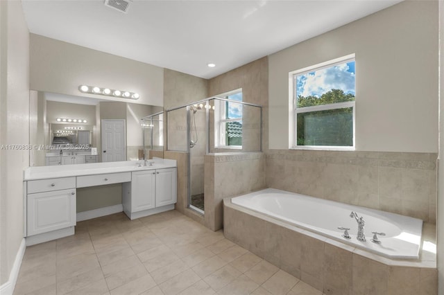 full bathroom with tile patterned flooring, vanity, a shower stall, visible vents, and a garden tub