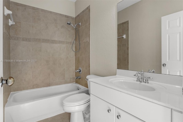 bathroom featuring tile patterned flooring, tub / shower combination, toilet, and vanity