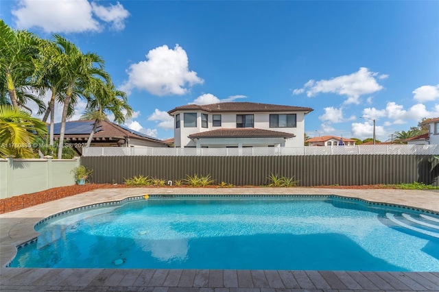 view of swimming pool with a fenced backyard and a fenced in pool