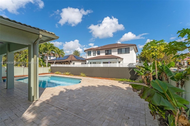 view of swimming pool with a fenced backyard, a fenced in pool, and a patio