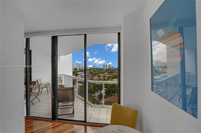 interior space featuring a city view and wood finished floors