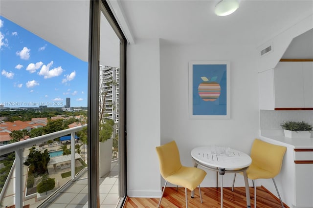 balcony featuring visible vents and a view of city