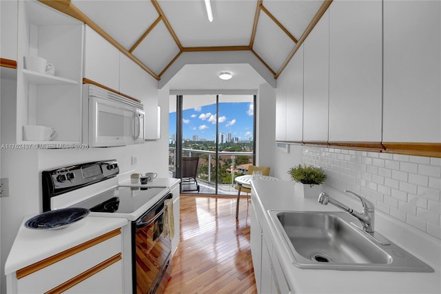 kitchen featuring open shelves, backsplash, electric range oven, lofted ceiling, and white microwave