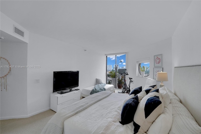 bedroom featuring visible vents, baseboards, and carpet floors