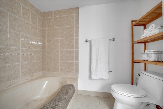 full bath with tile patterned flooring, toilet, and a tub to relax in