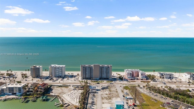 drone / aerial view with a city view and a water view