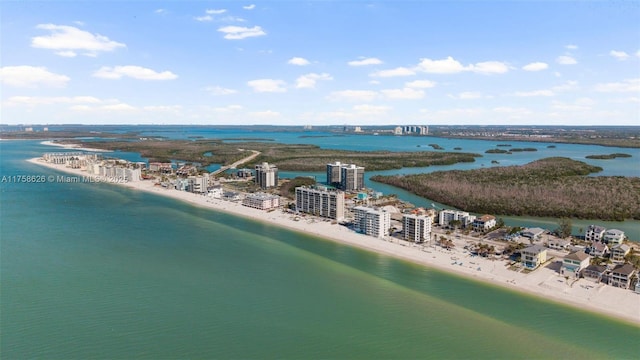 birds eye view of property featuring a view of the beach and a water view