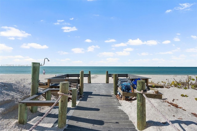 exterior space with a beach view and a water view