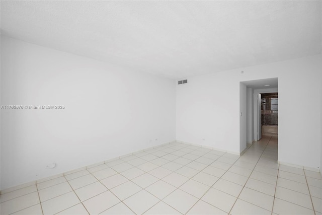 5601 Collins Ave Unit 1604, Miami Beach, FL 33140 - empty room featuring light tile patterned floors and visible vents