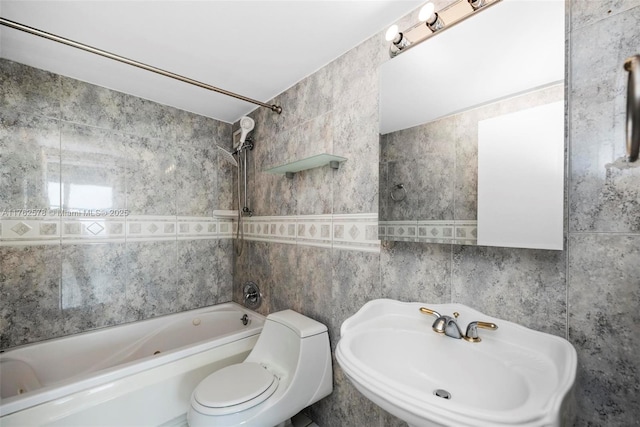 5601 Collins Ave Unit 1604, Miami Beach, FL 33140 - bathroom featuring a sink, toilet, tile walls, and bathtub / shower combination
