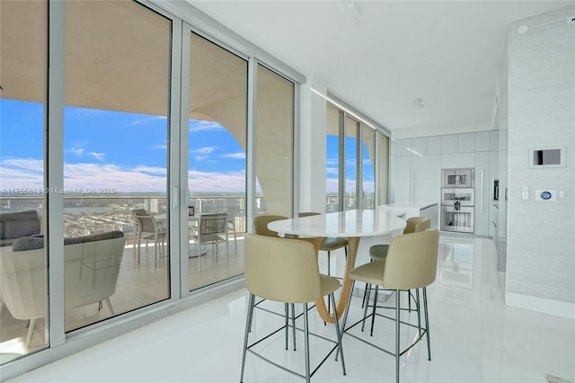 dining room featuring a wall of windows