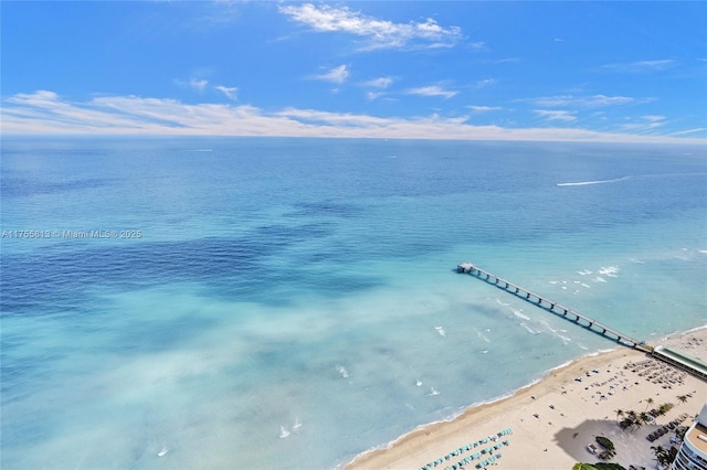 bird's eye view featuring a water view and a view of the beach