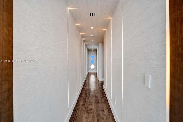 hallway with visible vents and dark wood-style flooring