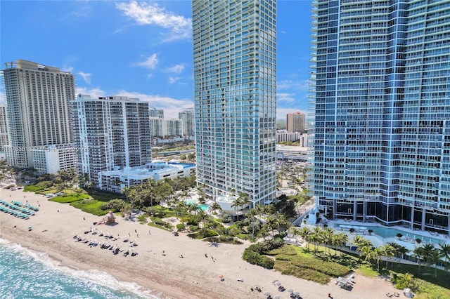 property's view of city with a water view and a view of the beach