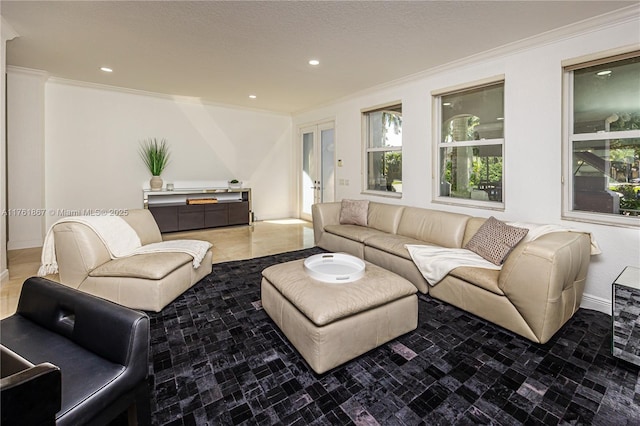 living room featuring a healthy amount of sunlight, recessed lighting, and ornamental molding