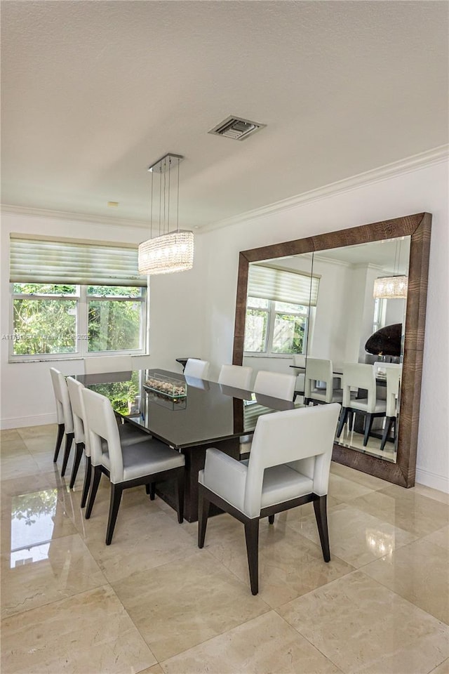 dining space featuring a wealth of natural light, visible vents, marble finish floor, and crown molding