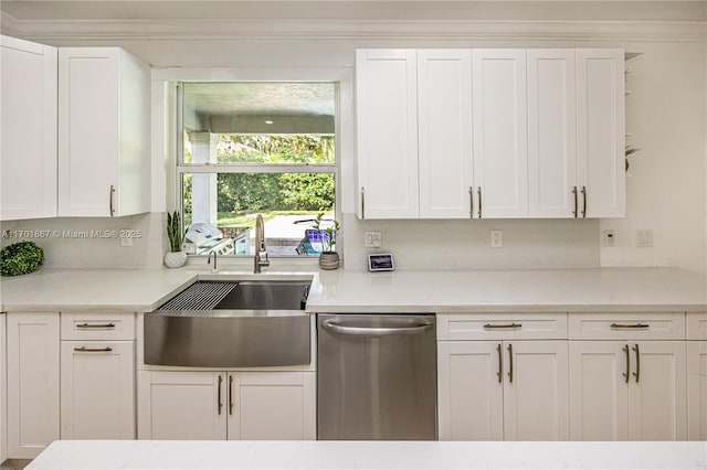 kitchen with dishwasher, crown molding, white cabinets, and a sink