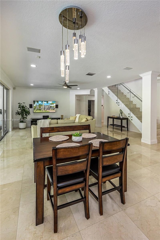 dining space with stairs, visible vents, marble finish floor, and a textured ceiling