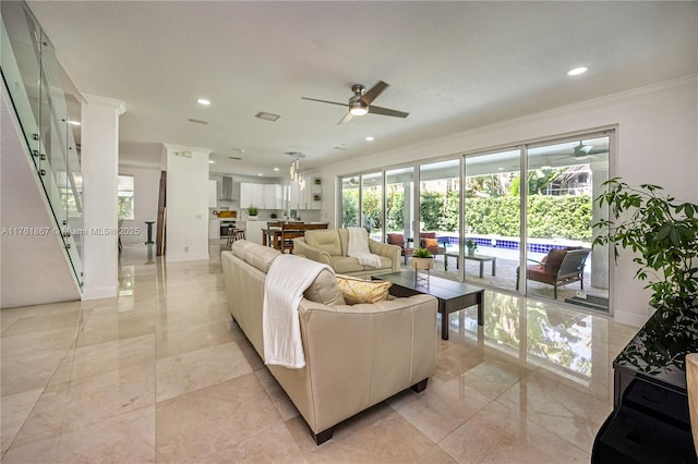 living room featuring visible vents, recessed lighting, crown molding, baseboards, and ceiling fan