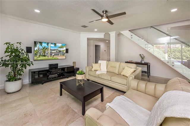 living room featuring visible vents, ornamental molding, a ceiling fan, a textured ceiling, and recessed lighting