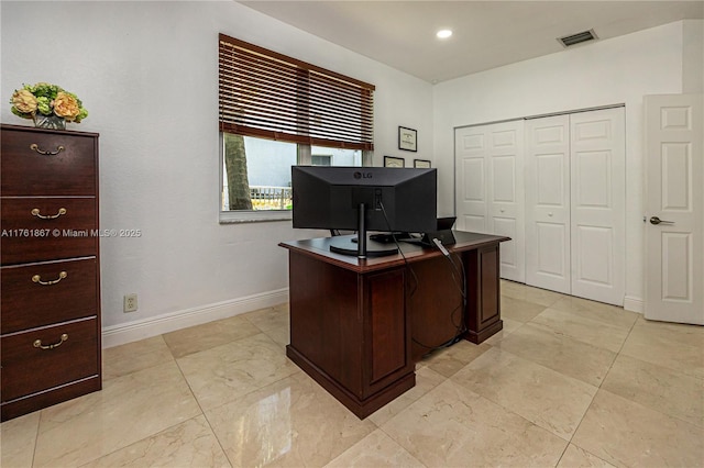 home office featuring visible vents and baseboards