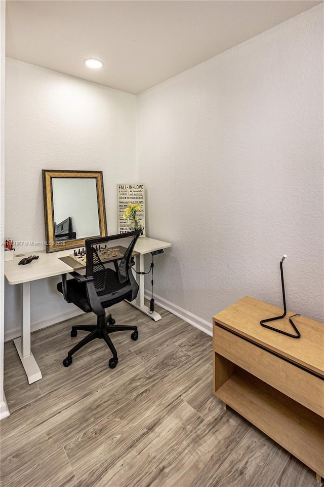 office with recessed lighting, baseboards, and wood finished floors