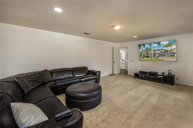 living area featuring recessed lighting, visible vents, carpet floors, and a textured ceiling