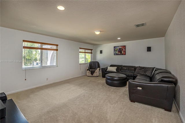 living room featuring recessed lighting, visible vents, light colored carpet, and baseboards