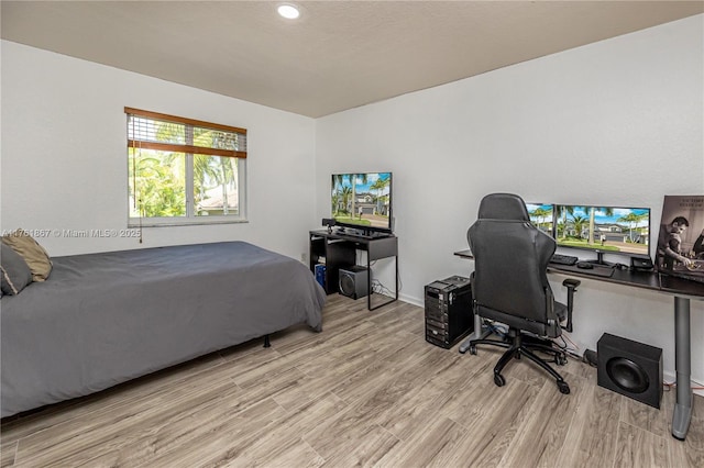 bedroom featuring light wood finished floors