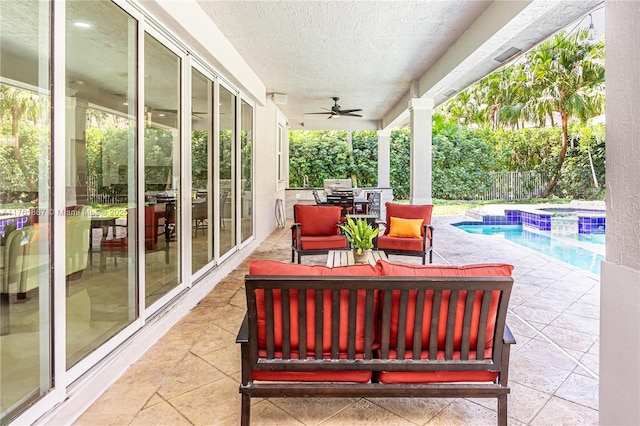 view of patio featuring a pool with connected hot tub, outdoor lounge area, a ceiling fan, and fence