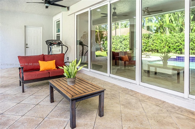 view of patio / terrace featuring ceiling fan