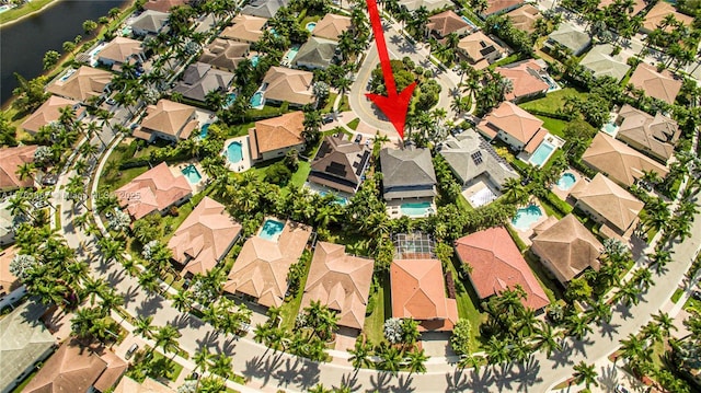 aerial view featuring a residential view and a water view