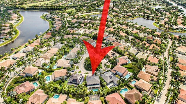 aerial view featuring a residential view and a water view