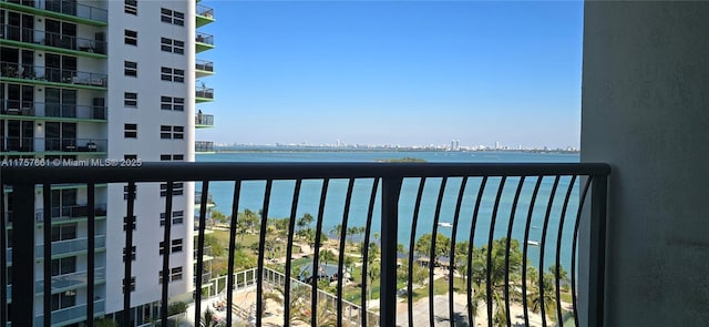 balcony featuring a water view