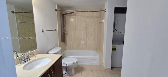 full bathroom featuring tile patterned floors, stacked washer and dryer, toilet, shower / bath combination, and vanity