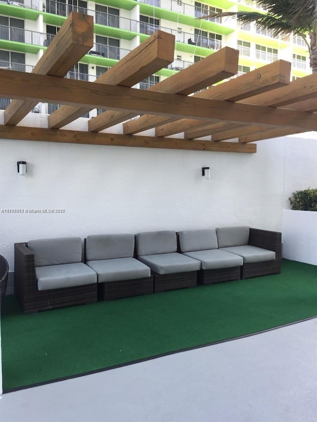 view of patio / terrace with a balcony and outdoor lounge area