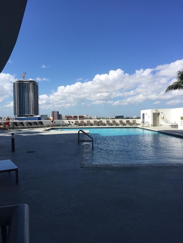 pool featuring a view of city