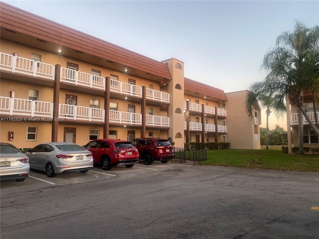 view of property with uncovered parking