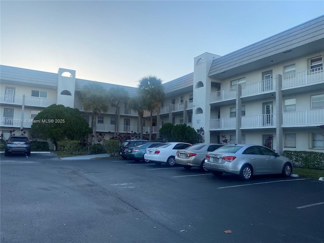 view of property featuring uncovered parking