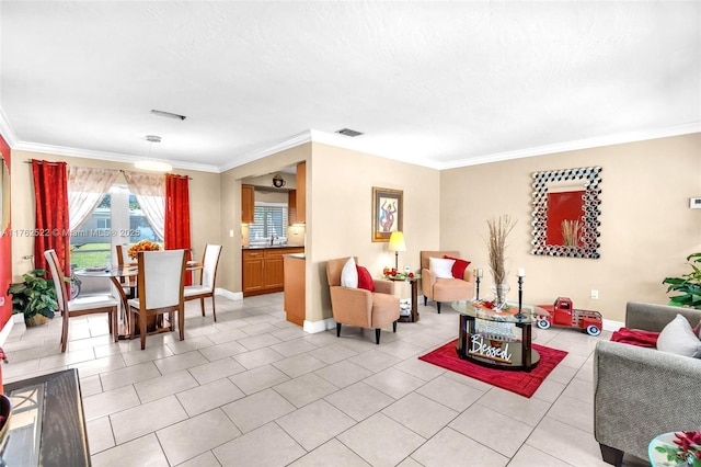 living room with light tile patterned flooring, crown molding, and baseboards